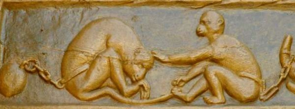 Monkeys playing slaves - sculpture in wood - source: Kommissio für das Deutsche Rechtswörterbuch, Heidelberg